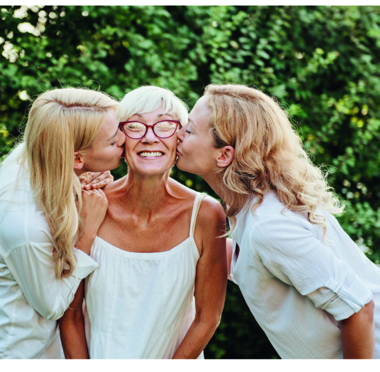 daughters kissing mum